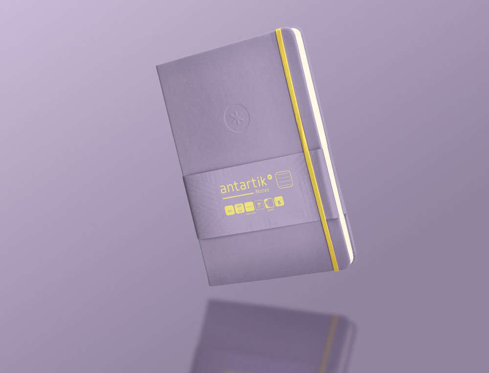 CADERNO COM ELASTICO ANTARTIK NOTES CAPA DURA A5 PAUTADO ROXO E AMARELO 100 FOLHAS 80 GR FSC