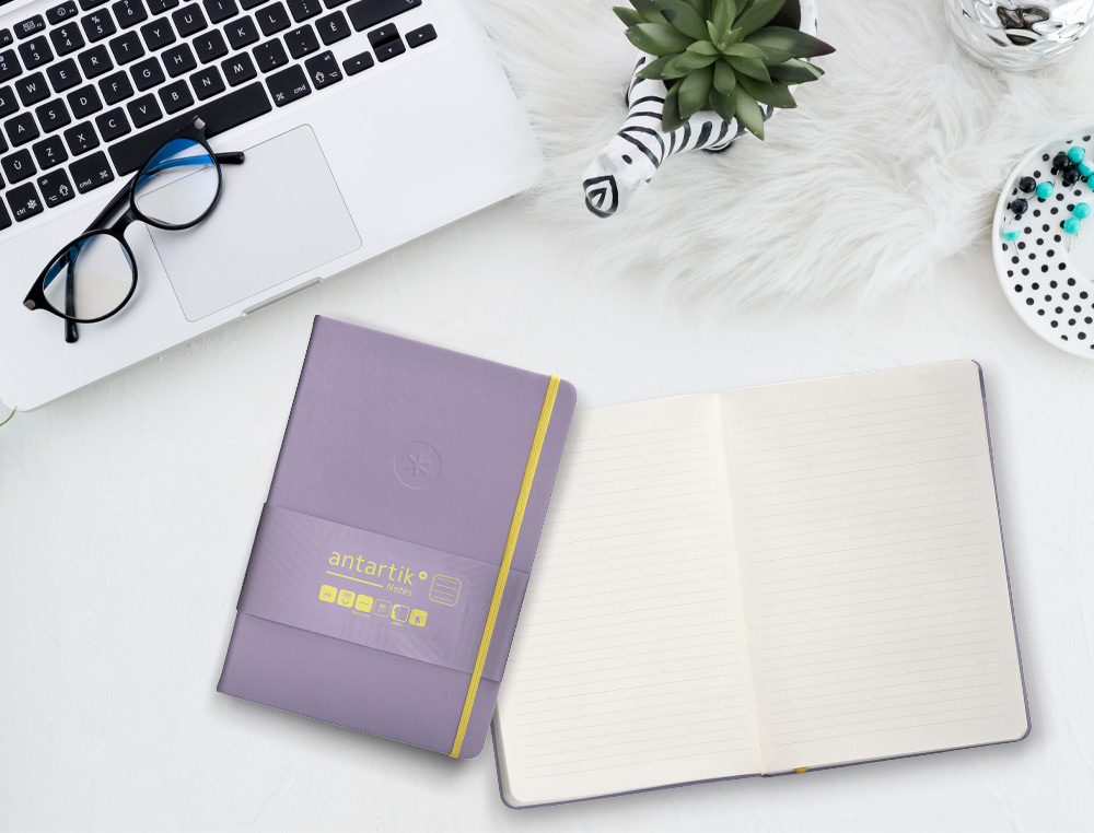 CADERNO COM ELASTICO ANTARTIK NOTES CAPA DURA A5 PAUTADO ROXO E AMARELO 100 FOLHAS 80 GR FSC