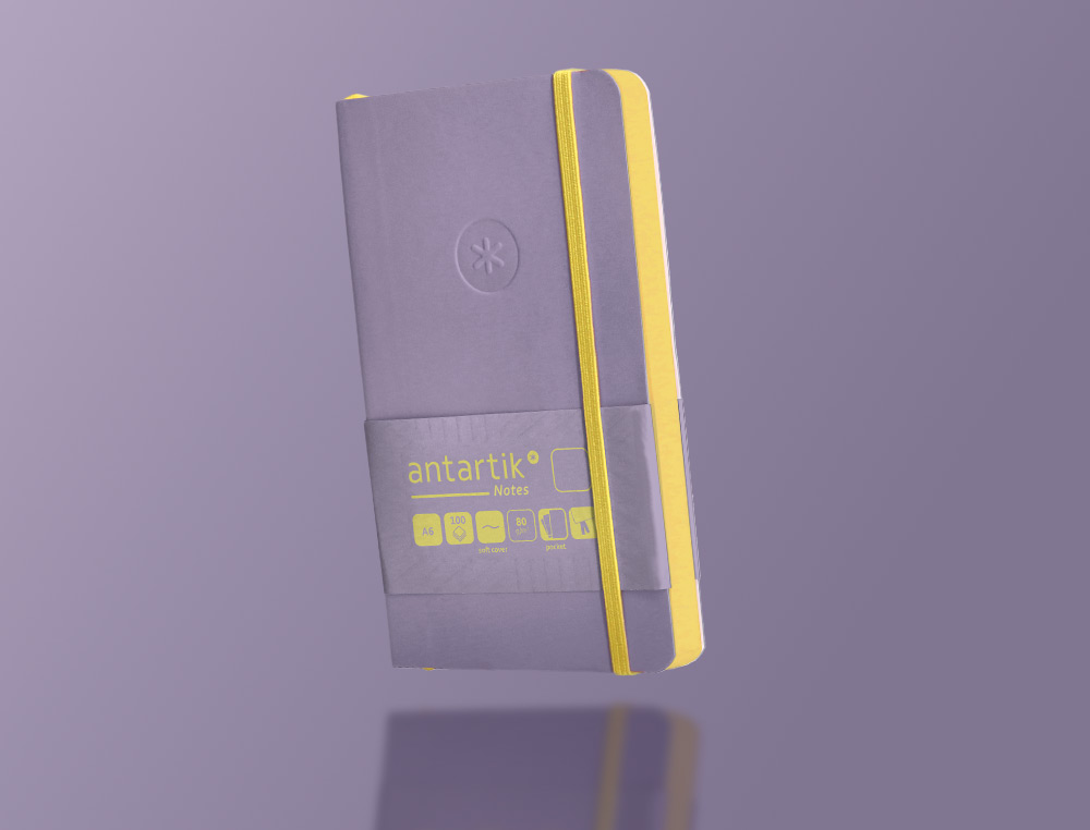 CADERNO COM ELASTICO ANTARTIK NOTES CAPA MOLE A6 LISO ROXO E AMARELO 100 FOLHAS 80 GR FSC